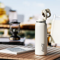 Coca-Cola-Termo Estilo Deportivo Oficial Original de Acero Inoxidable 316 Grado alimenticio Fría/caliente hermética Portátil Apertura y cierre con un solo dedo Doble función de tapa Pajita antideslizante 600ml Blanco/Negro/Rosa>200