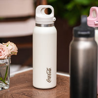 Coca-Cola-Termo Estilo Deportivo Oficial Original de Acero Inoxidable 316 Grado alimenticio Fría/caliente hermética Portátil Apertura y cierre con un solo dedo Doble función de tapa Pajita antideslizante 600ml Blanco/Negro/Rosa>200