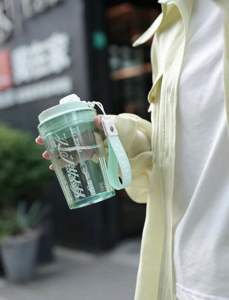 Coca-Cola Oficial Original-Vaso Tritan-Plástico Alimenticio Resistente a impactos resistente a químicos portátil Diseño de tapa de tirador desmontable hermético antideslizante 390ml Rosa/Púrpura/Verde/