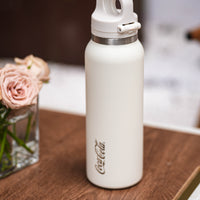 Coca-Cola-Termo Estilo Deportivo Oficial Original de Acero Inoxidable 316 Grado alimenticio Fría/caliente hermética Portátil Apertura y cierre con un solo dedo Doble función de tapa Pajita antideslizante 600ml Blanco/Negro/Rosa＞200