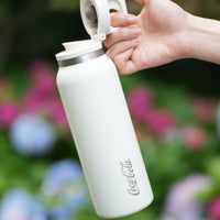 Coca-Cola-Termo Estilo Deportivo Oficial Original de Acero Inoxidable 316 Grado alimenticio Fría/caliente hermética Portátil Apertura y cierre con un solo dedo Doble función de tapa Pajita antideslizante 600ml Blanco/Negro/Rosa＞200